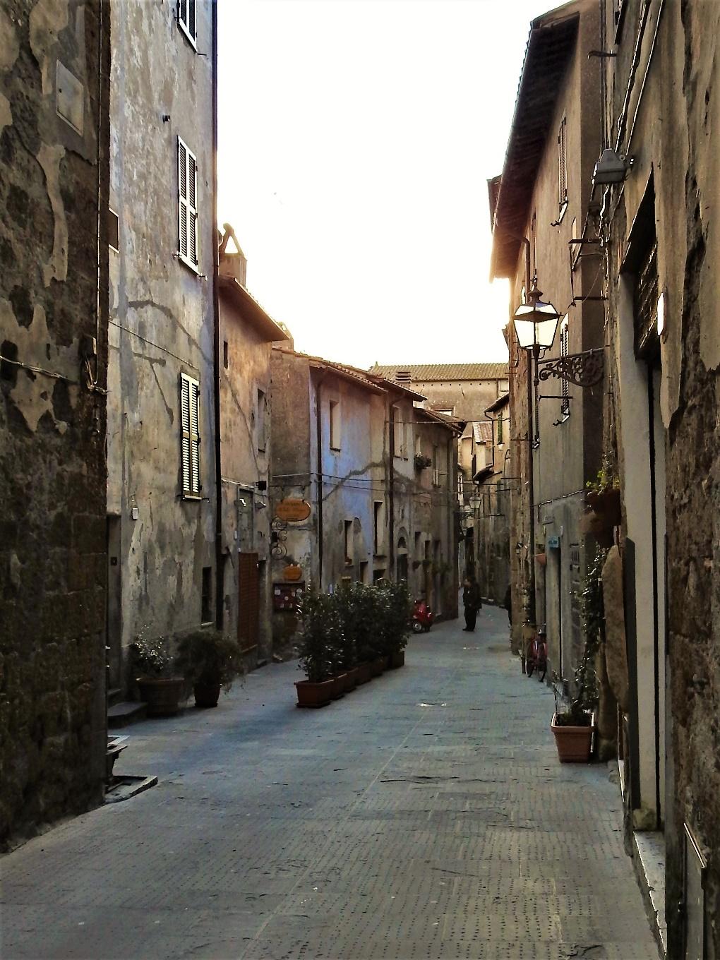 A narrow city street
Description generated with very high confidence