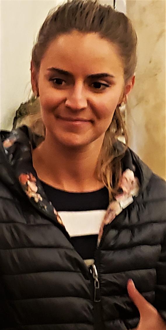 A person posing for the cameraDescription automatically generated