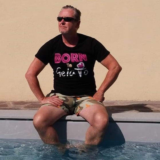 A person that is sitting in the waterDescription automatically generated