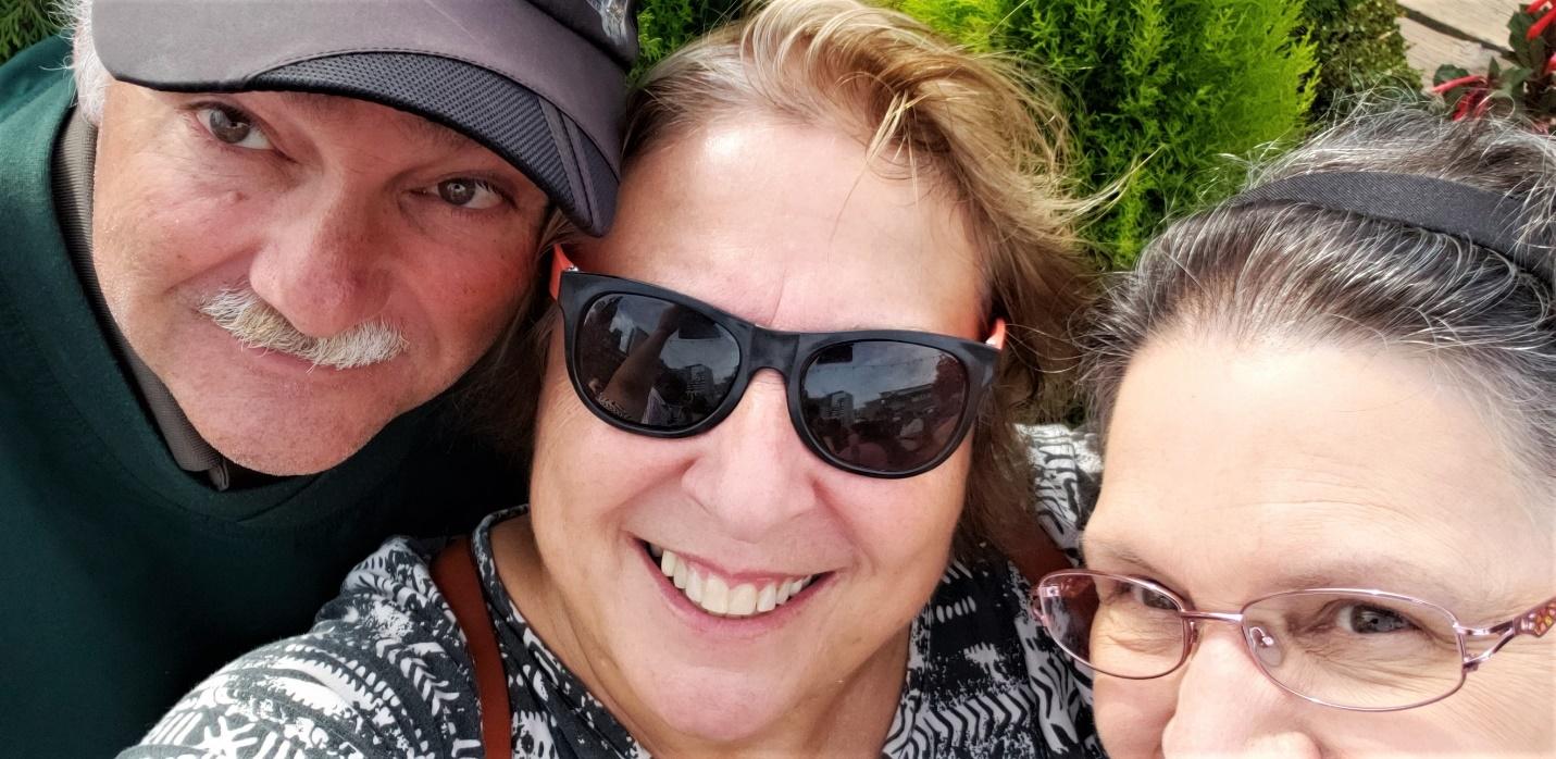 A close up of a person wearing sunglassesDescription automatically generated