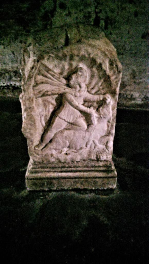 A picture containing text, old, stone, building materialDescription automatically generated