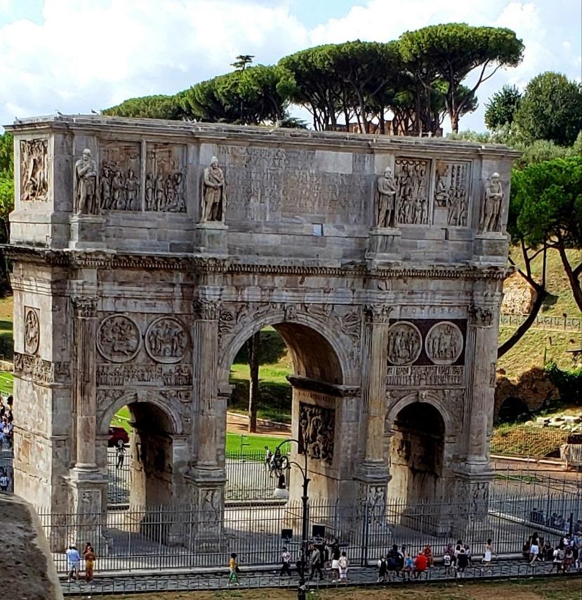 A picture containing sky, outdoor, arch, stoneDescription automatically generated