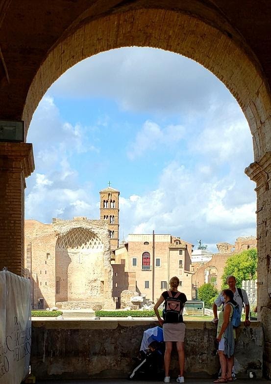 A picture containing building, arch, stone, colonnadeDescription automatically generated