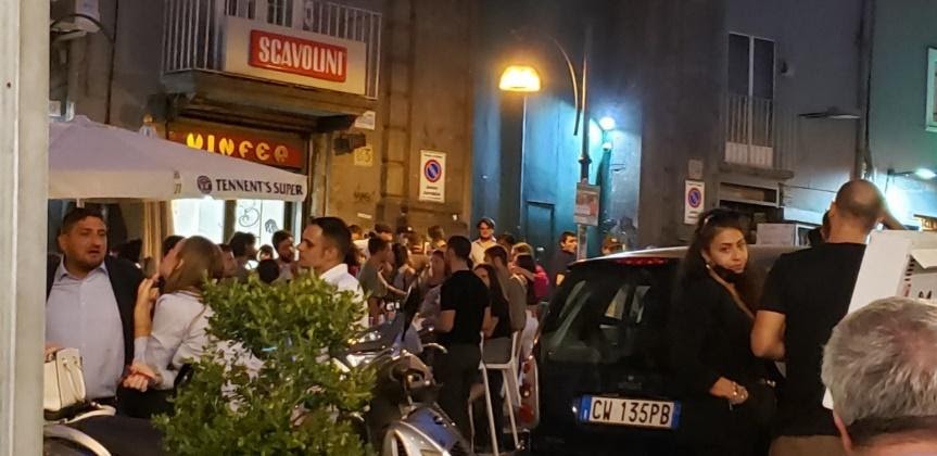 A group of people outside a buildingDescription automatically generated with low confidence