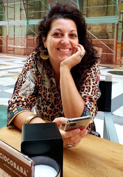 A person sitting at a tableDescription automatically generated with medium confidence
