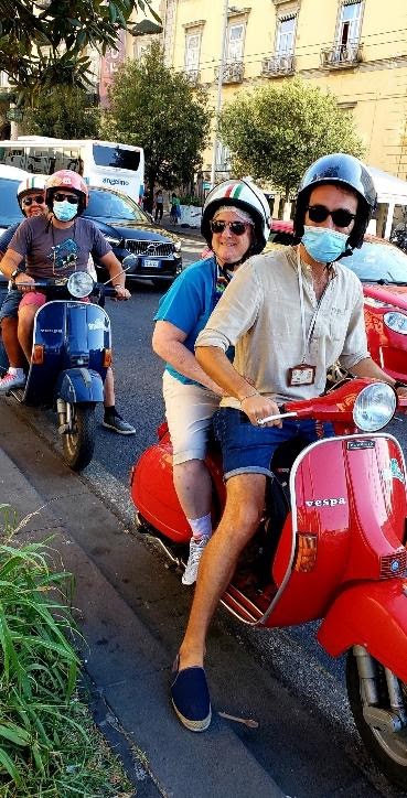 A group of people riding scootersDescription automatically generated with medium confidence