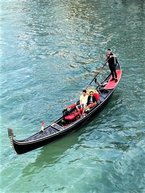 A group of people in a boatDescription automatically generated with medium confidence