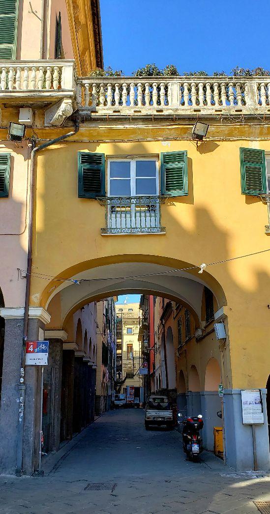 A picture containing building, outdoor, yellow, oldDescription automatically generated