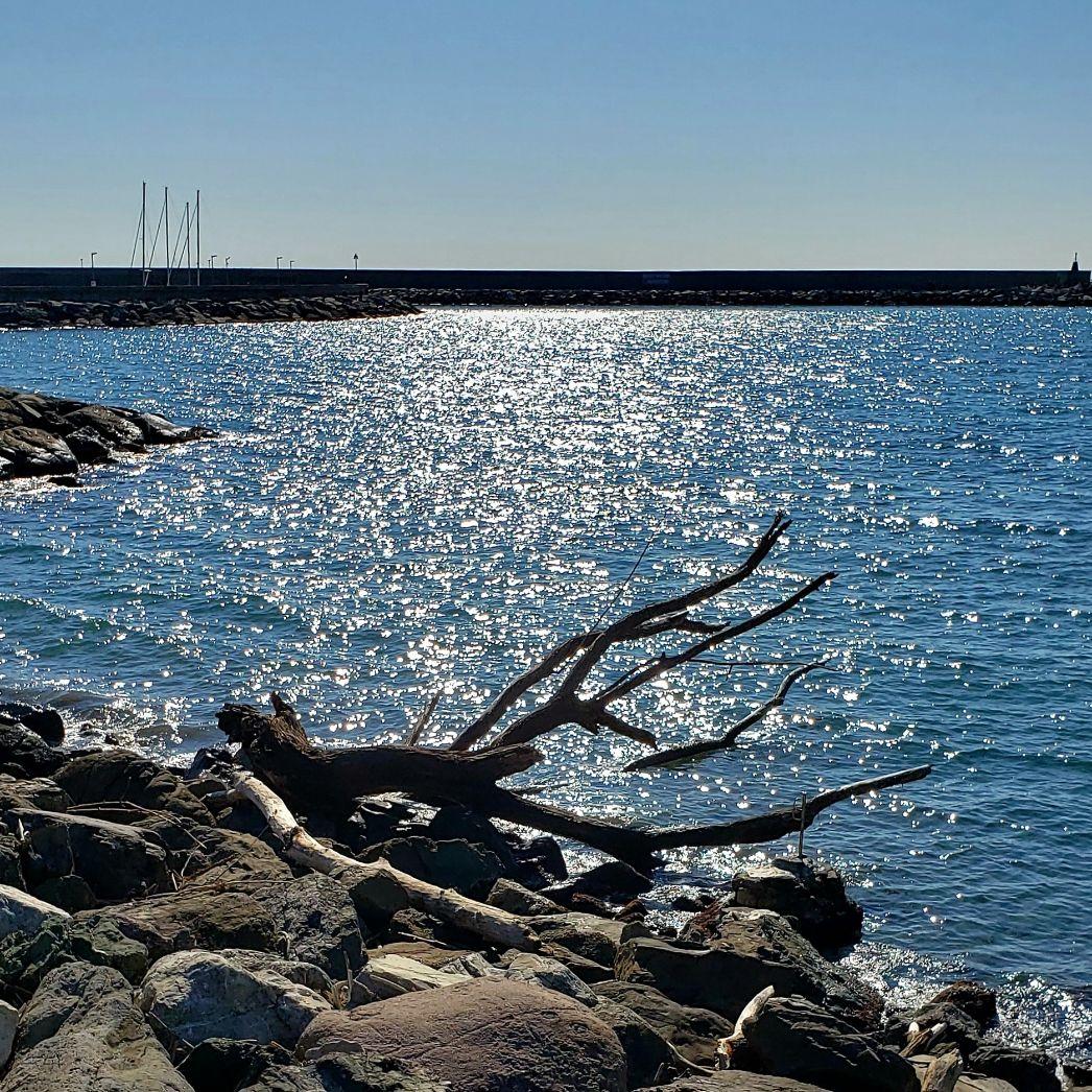 A picture containing water, outdoor, sky, rockDescription automatically generated