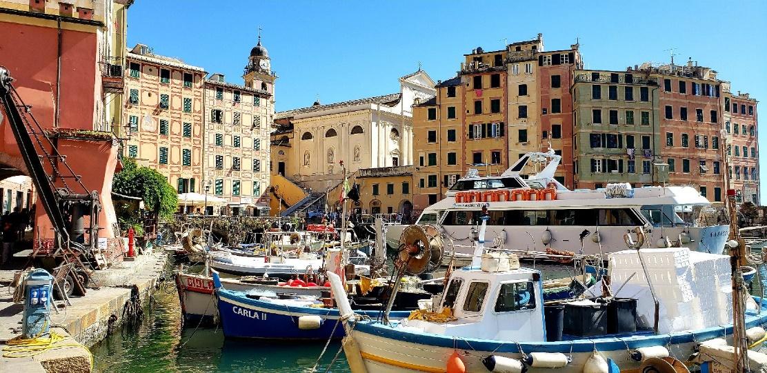 A picture containing building, boat, outdoor, skyDescription automatically generated