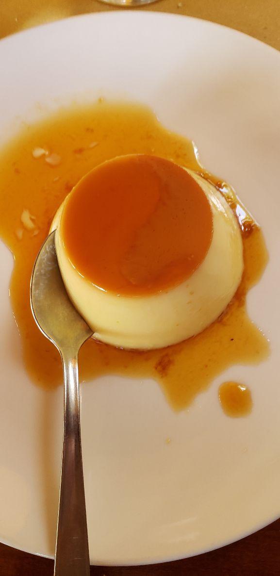 A spoon in a bowl of foodDescription automatically generated with low confidence