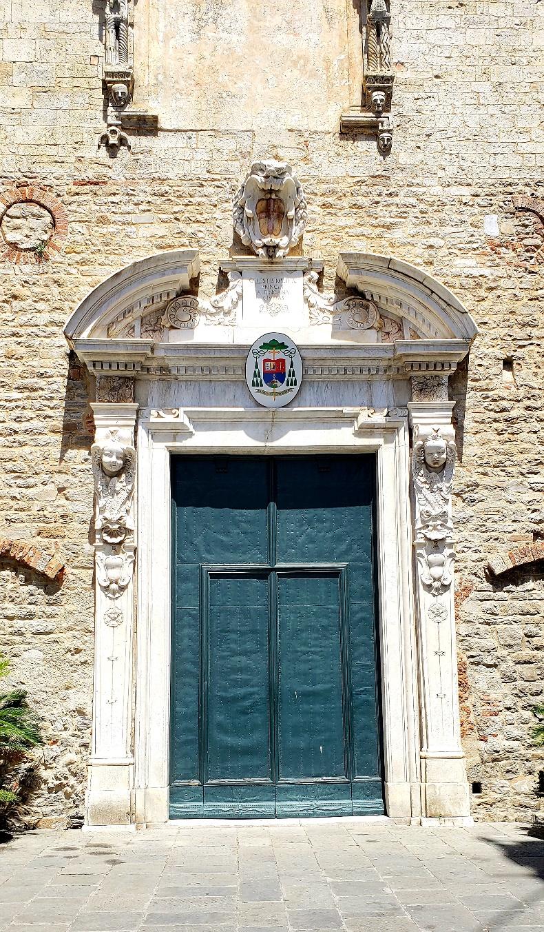 A blue door in a stone buildingDescription automatically generated with medium confidence