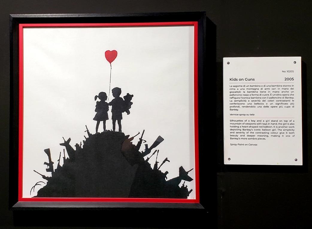 A picture containing text, gallery, picture frameDescription automatically generated