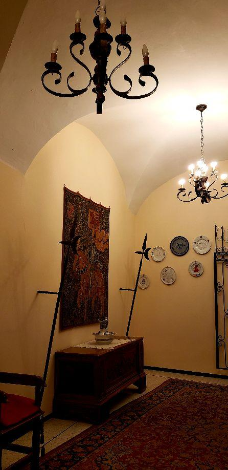 A chandelier from a ceilingDescription automatically generated with low confidence