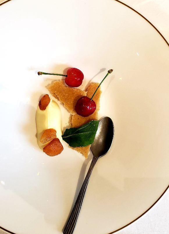 A plate of food with a spoonDescription automatically generated with low confidence