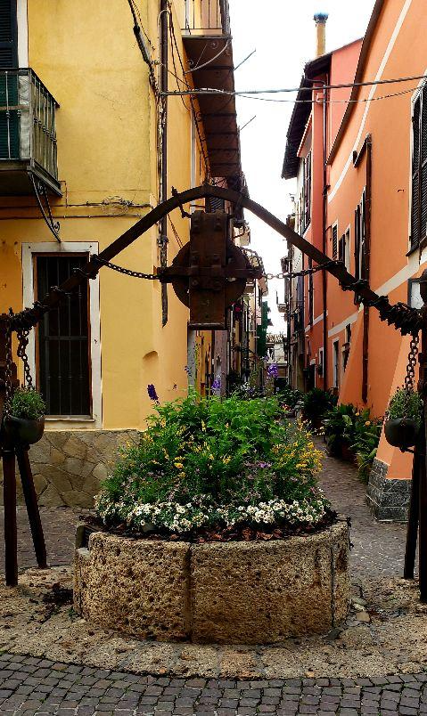 A picture containing outdoor, building, window, flowerpotDescription automatically generated