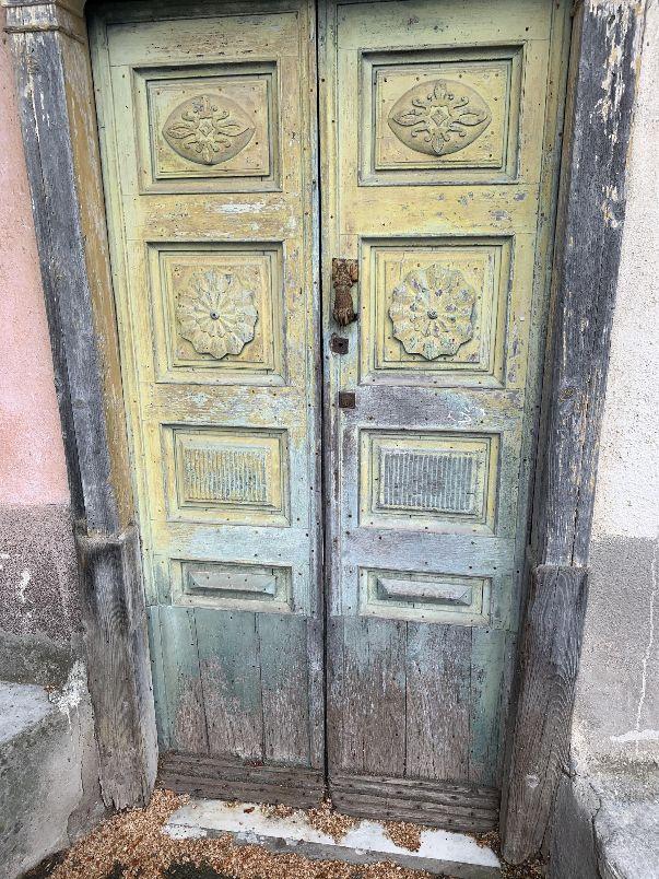 A picture containing building, door, home door, door handleDescription automatically generated