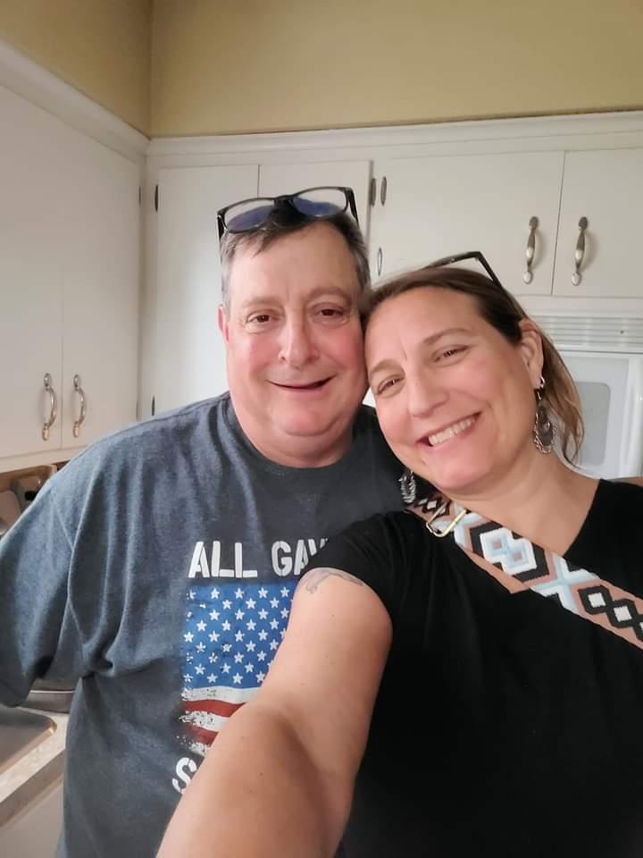 A person and person taking a selfieDescription automatically generated