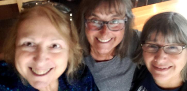 Two women taking a selfieDescription automatically generated