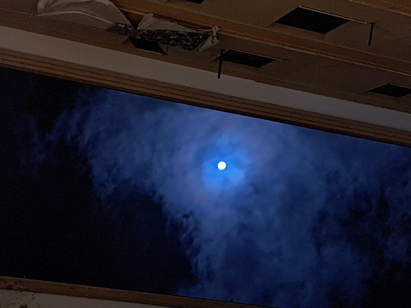 A moon in the skyDescription automatically generated