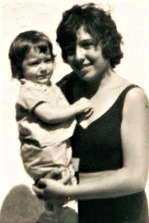 A person holding a babyDescription automatically generated