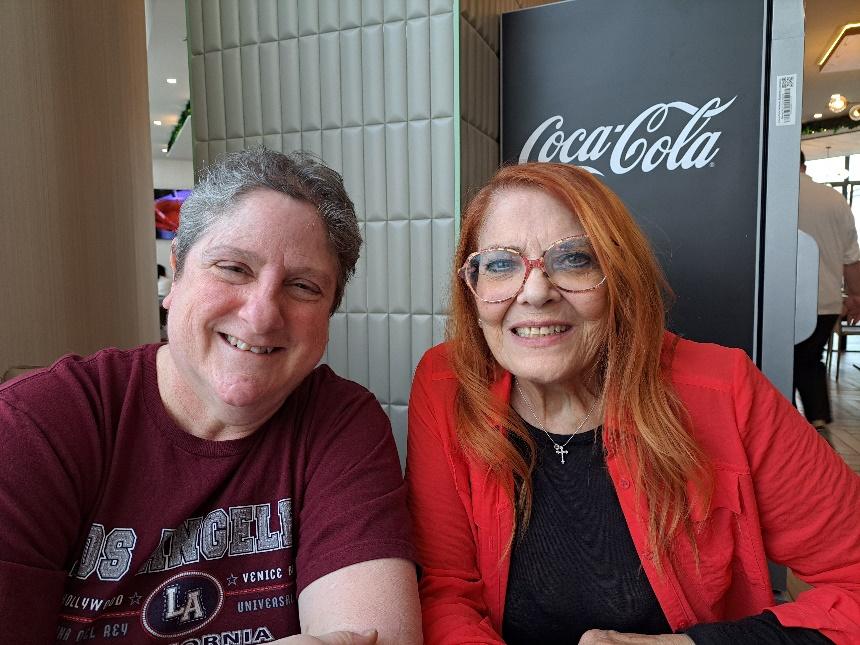 A person and person smiling for a pictureDescription automatically generated