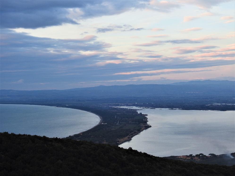 A view of a body of water and a cityAI-generated content may be incorrect.
