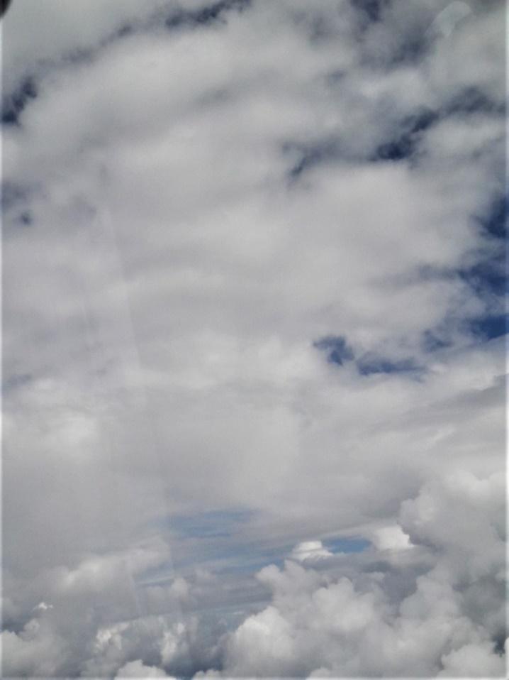 A group of clouds in the sky

Description generated with very high confidence